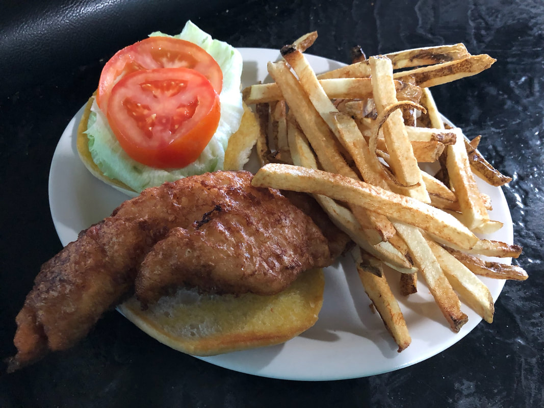 fish sanwich with french fries at jades bar and restaurant in depew new york