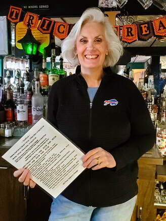 Pattie with menu welcomes you to Jades Bar Restaurant in Depew New York