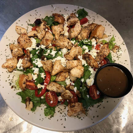 nutty goat cheese salad with chicken at jades bar and restaurant